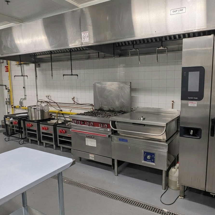 MiFoodStudio health-inspected commercial cook line under the exhaust hood